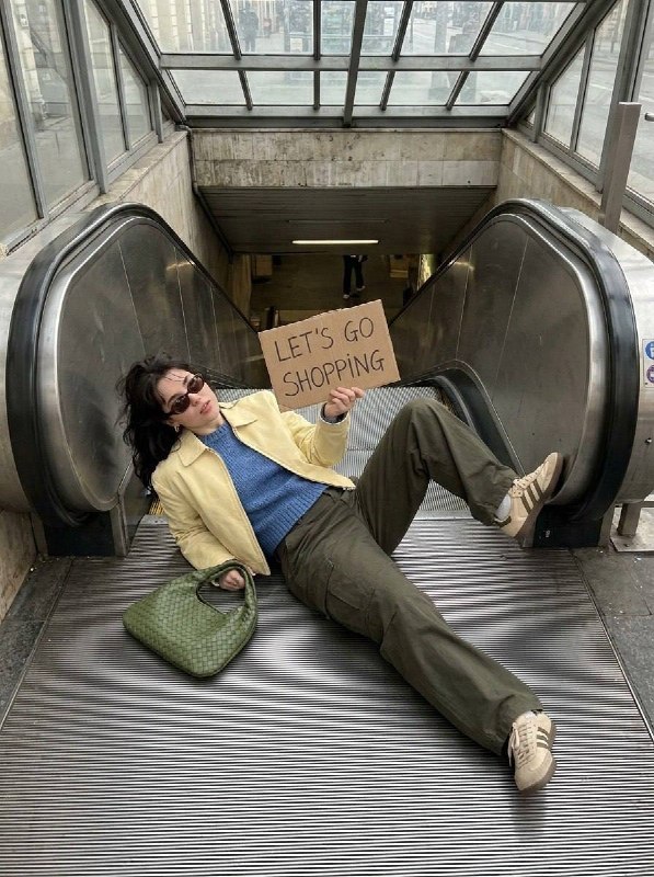 A young woman lying on an escalator, shot from a high overhead angle, wearing a …؛ پرامپت فارسی برای ساخت عکس با هوش مصنوعی